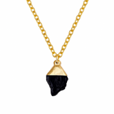 Necklace with a gold and black pendant on a white background