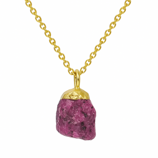 Gold necklace with a pink stone pendant on a white background