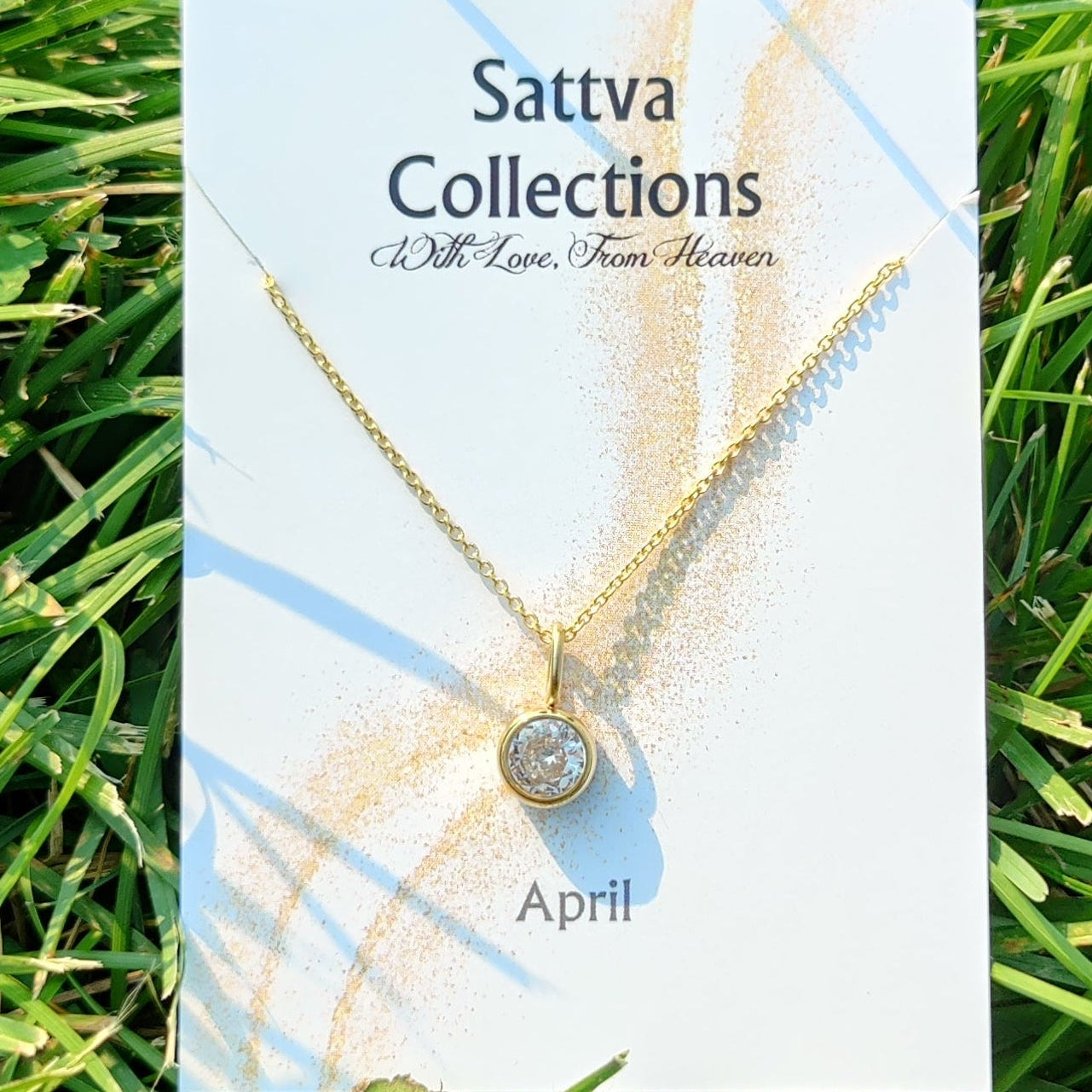 Sattva Collections necklace card on grass