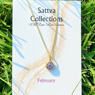 Sattva Collections necklace card on grass