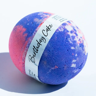 Bath bomb with 'Birthday Cake' label on a white background