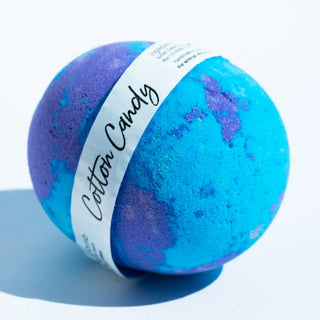 Blue and purple bath bomb with 'Cotton Candy' label on a white background