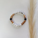Beaded bracelet with multicolor beads on a white surface