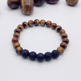 Beaded bracelet with brown and blue beads on a white background