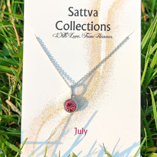 Sattva Collections necklace card on grass