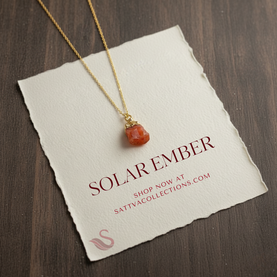 Necklace with a red pendant on a 'Solar Ember' card with branding information.